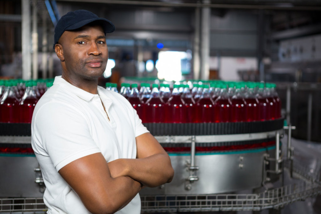 Male employee at a bottling factory