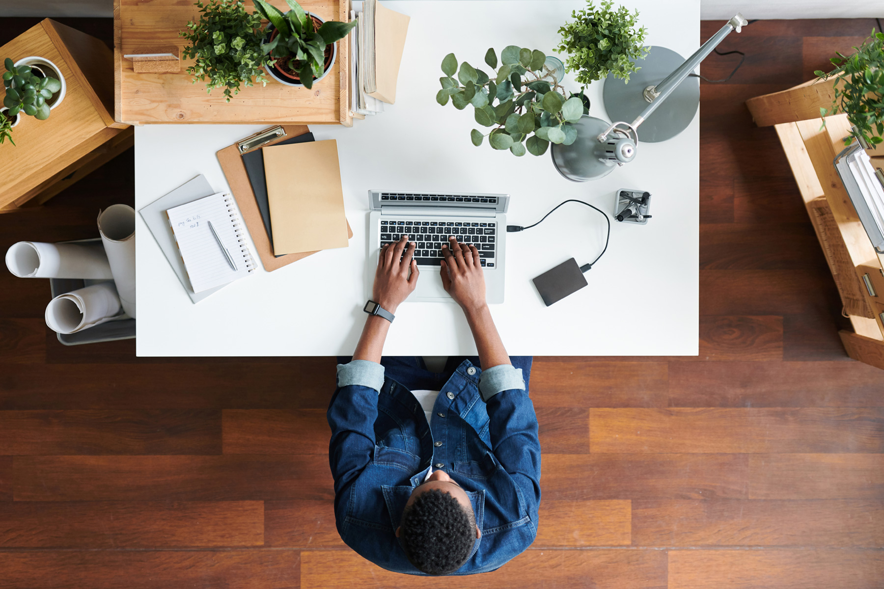 Person learning and working on a laptop.